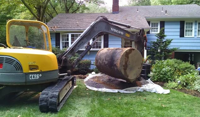 Our skilled technicians removing a heating oil tank OilTankAssurance.com
